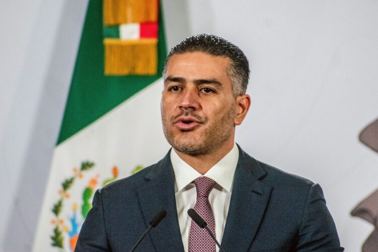 MEXICO CITY, MEXICO - FEBRUARY 23: Secretary of Security and Citizen Protection Omar Garcia Harfuch speaks during the daily morning briefing at Palacio Nacional on February 23, 2026 in Mexico City, Mexico. (Photo by Haarón Álvarez/ObturadorMX/Getty Images)